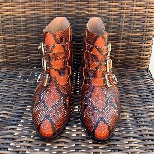 Chloe “Suzanna” studded animal print boots.